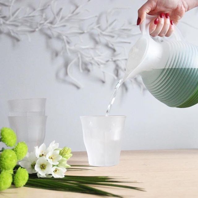 Duralex Le Picardie® Frosted Glass Tumblers in use, with a pitcher pouring water and decorative flowers, highlighting their versatile style and functionality.